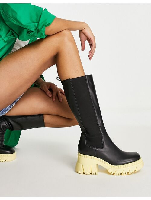ASOS DESIGN Capricorn premium leather chunky Chelsea knee boots in black with yellow sole