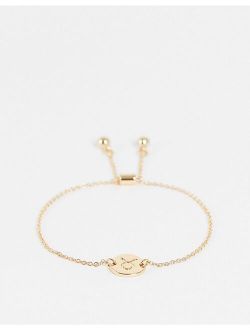 bracelet with Taurus zodiac charn in gold tone