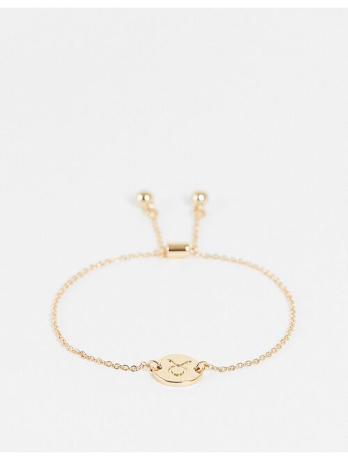 ASOS DESIGN bracelet with Taurus zodiac charn in gold tone