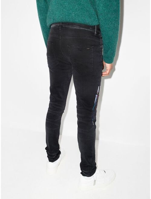 AMIRI logo-embroidered skinny jeans