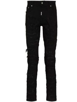 Represent ripped distressed skinny jeans