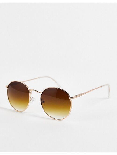 ASOS DESIGN metal round sunglasses in gold with brown lens