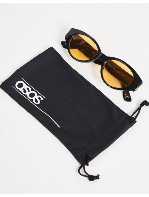 ASOS DESIGN retro recycled oval sunglasses with amber lens in black
