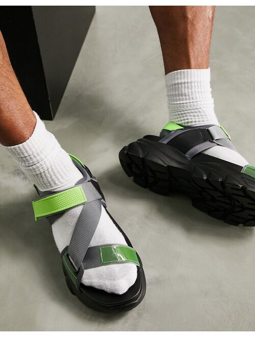 ASOS DESIGN tech sandals in black and neon green on chunky sole