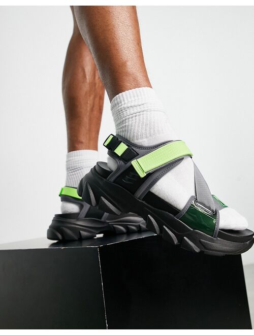ASOS DESIGN tech sandals in black and neon green on chunky sole