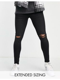 spray-on jeans in power stretch in black with busted knee