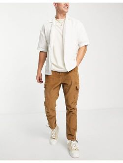 tapered fit cargo pants in cord in brown