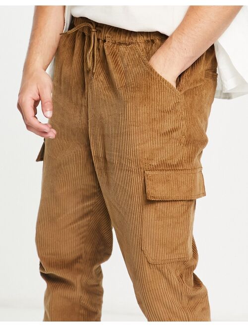 ASOS DESIGN tapered fit cargo pants in cord in brown