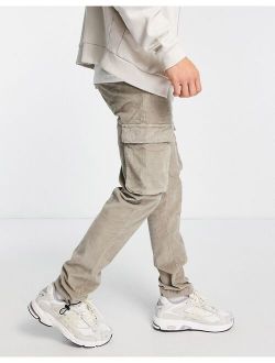 slim corduroy pants with cargo pockets in beige