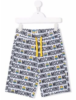 Kids Minions all-over logo print shorts