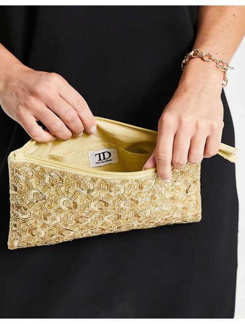 True Decadence zip top embellished clutch bag in geometric gold beading