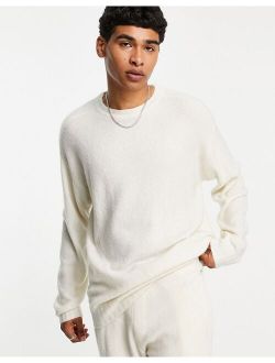 oversized knit sweater in ecru