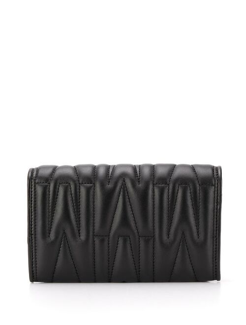 Moschino monogram-quilted clutch bag