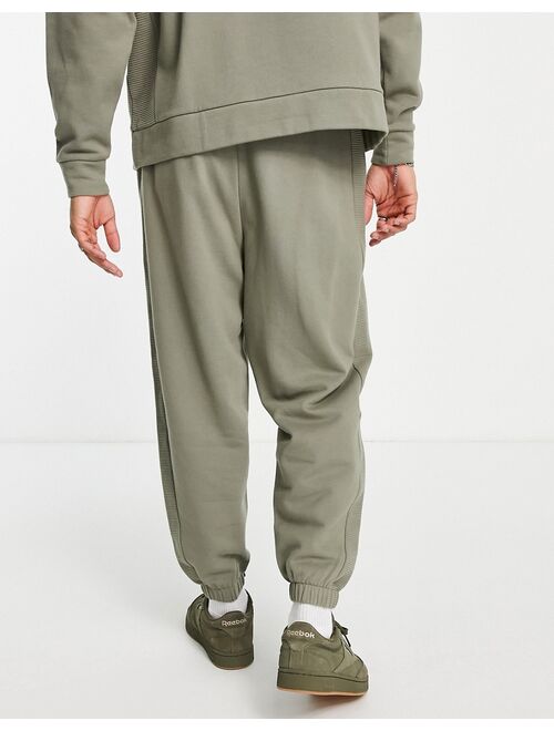 ASOS DESIGN oversized sweatpants with ribbed panels in green - part of a set