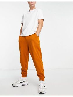 oversized sweatpants in washed orange