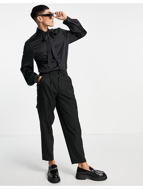 ASOS DESIGN satin shirt with tie neck and blouson volume sleeve in black