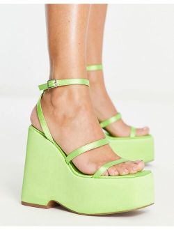 Number high wedge mules in lime