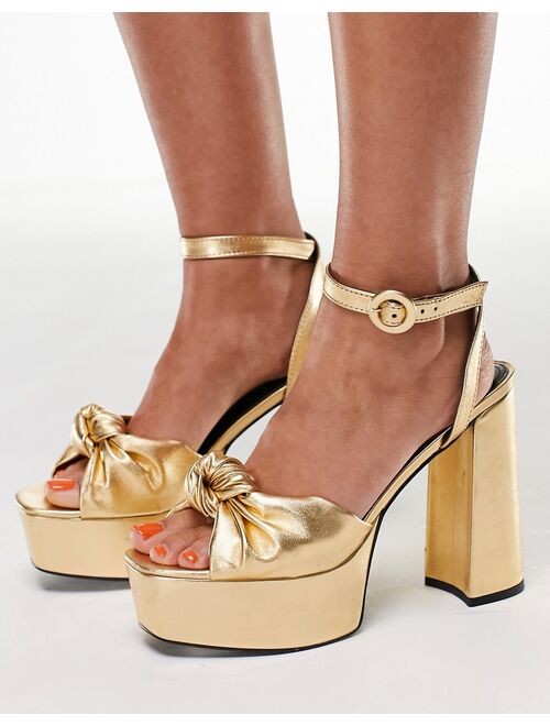 ASOS DESIGN Note knotted platform heeled sandals in gold