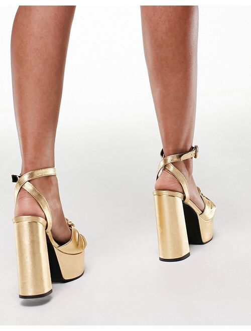 ASOS DESIGN Note knotted platform heeled sandals in gold
