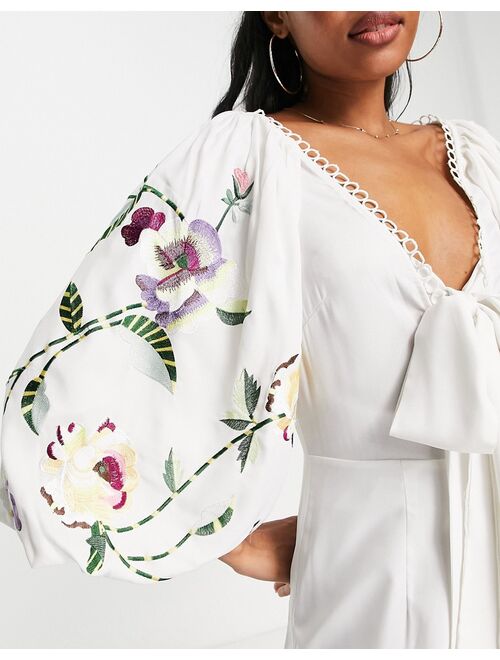 ASOS DESIGN occasion big sleeve tie front wide leg jumpsuit with embroidery