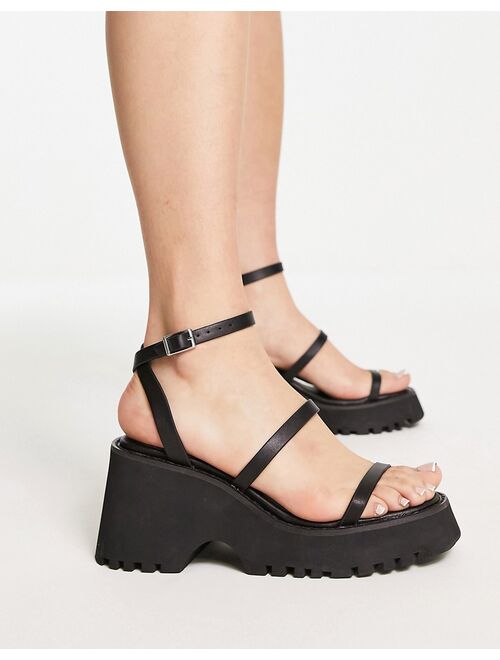 ASOS DESIGN Trip triple strap chunky cleated sandals in black