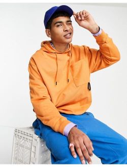 oversized hoodie with toggle details in orange