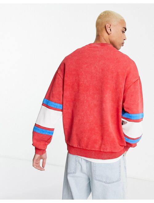ASOS DESIGN oversized sweatshirt in red and white blocking with print and wash