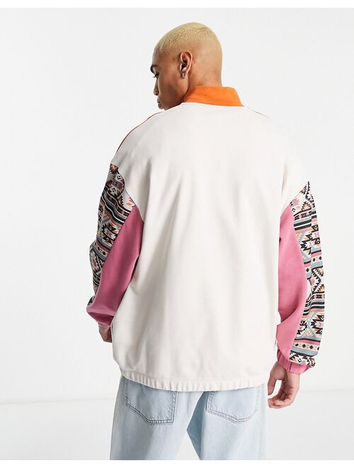 ASOS DESIGN oversized half zip festival sweatshirt in brown blocking with print