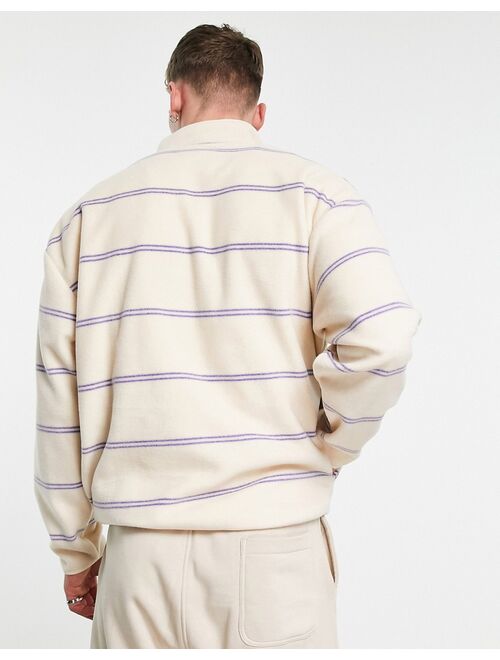 ASOS DESIGN oversized polar fleece half zip sweatshirt in all over stripe print