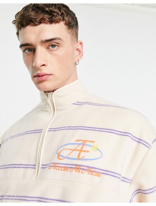 ASOS DESIGN oversized polar fleece half zip sweatshirt in all over stripe print