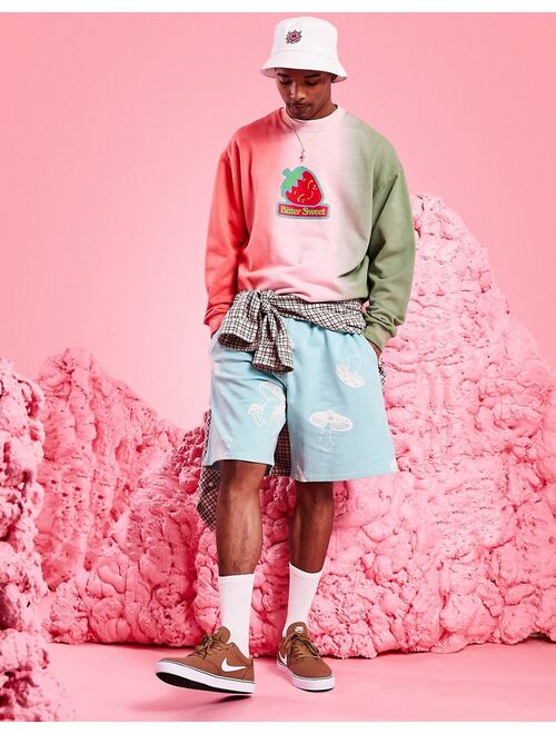 ASOS DESIGN oversized sweatshirt in ombre tie dye with strawberry print