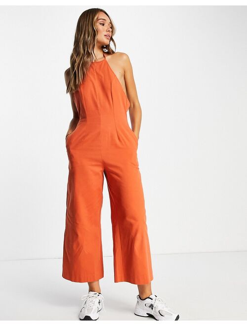 ASOS DESIGN twill strappy halterneck jumpsuit with wide leg in rust