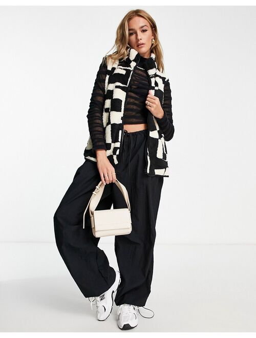 Monki teddy borg vest in black and white abstract print