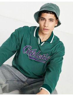 oversized long sleeve polo t-shirt in green with front print & v-neck