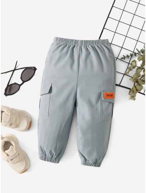 SHEIN Baby Letter Patched Detail Flap Pocket Pants