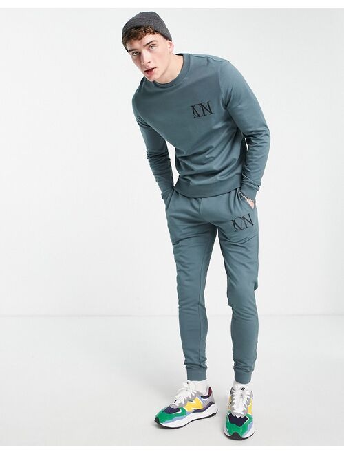 ASOS DESIGN lightweight tracksuit in dark gray with logo text print