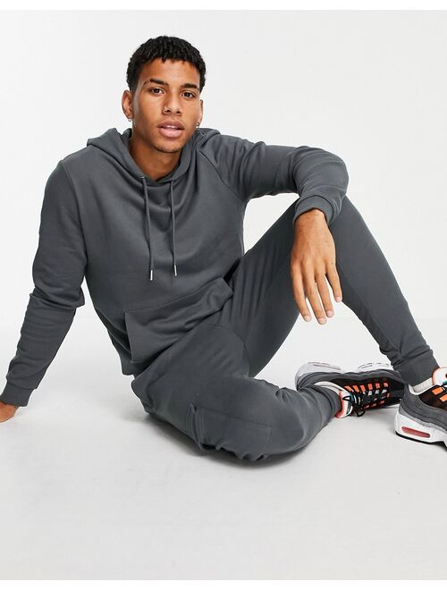ASOS DESIGN tracksuit with hoodie & skinny cargo sweatpants in washed black