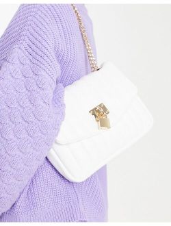 adjustable quilted shoulder bag with padlock in white