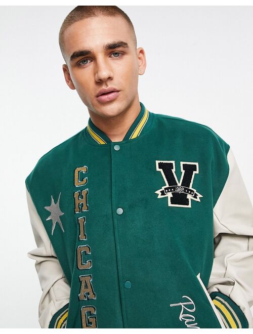 ASOS DESIGN oversized varsity bomber jacket with faux leather sleeves in green