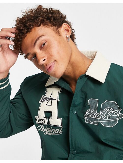 ASOS DESIGN varsity bomber jacket with contrast cord collar in green