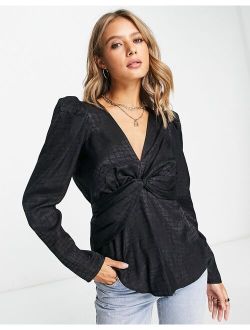 jacquard twist front top with puff shoulder in black