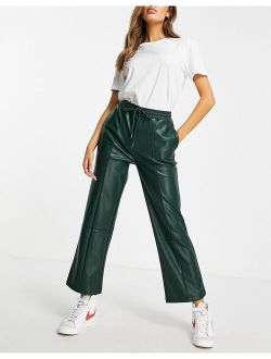 faux leather pants in dark green