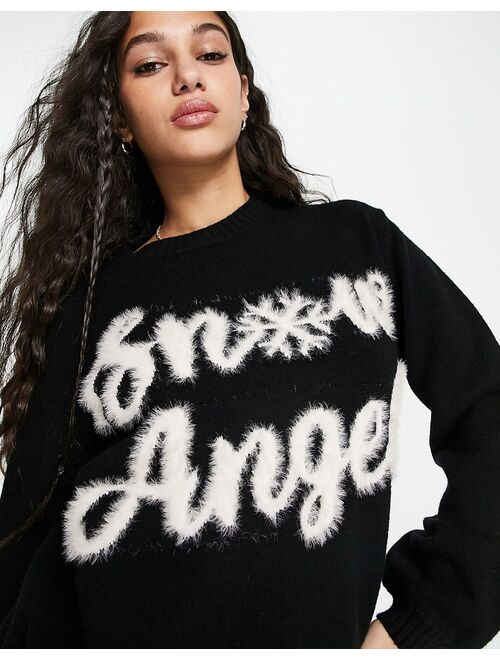 ASOS DESIGN Christmas sweater with fluffy snow angel pattern in black