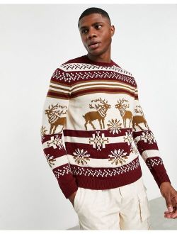 knitted christmas sweater with fairisle stag in red