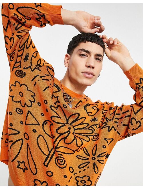 ASOS DESIGN knit oversized sweater with doodle design in orange