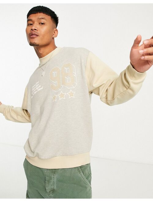 ASOS DESIGN oversized sweatshirt in tonal beige heather blocking with print