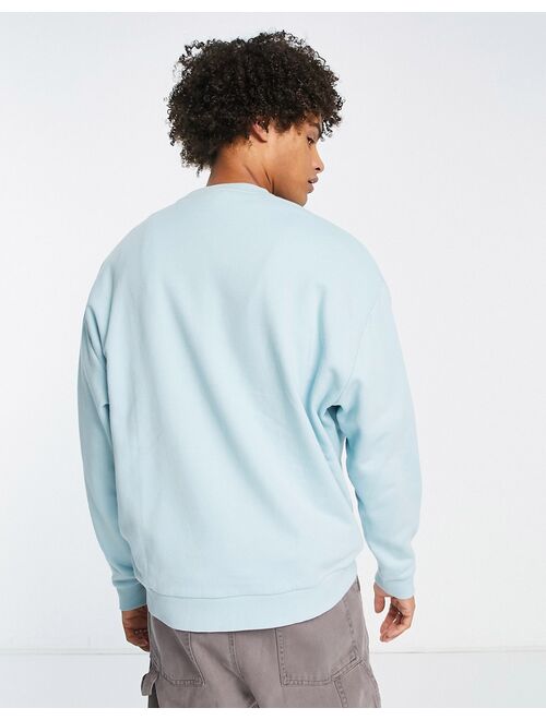 ASOS DESIGN oversized sweatshirt in light blue