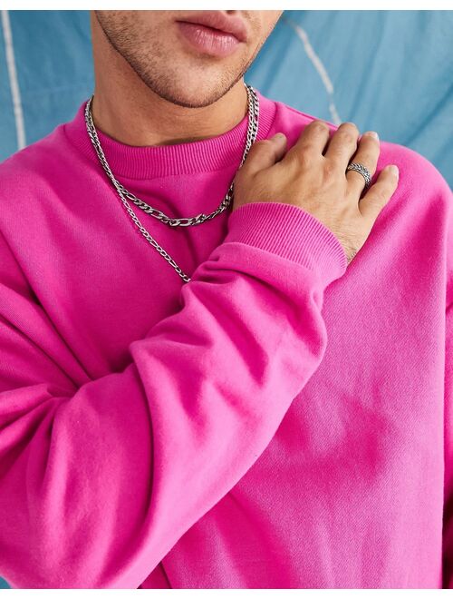 ASOS DESIGN oversized sweatshirt in bright pink