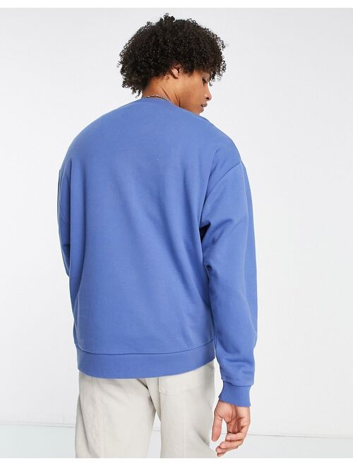 ASOS DESIGN oversized sweatshirt in blue