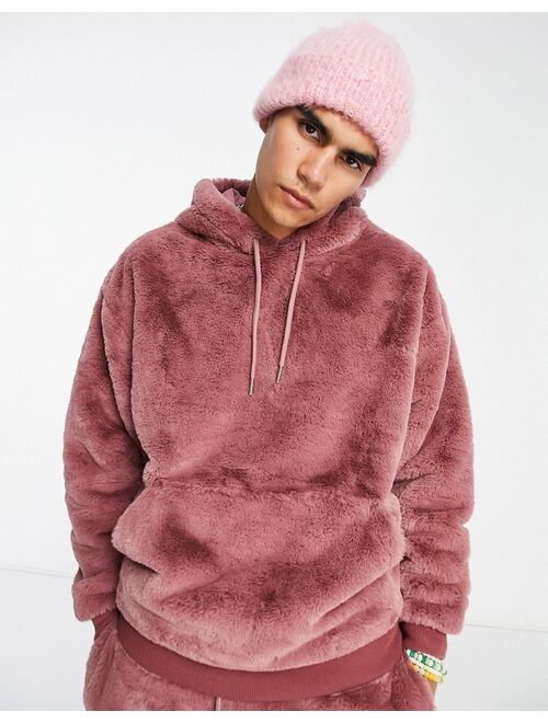 ASOS DESIGN oversized hoodie in pink faux fur